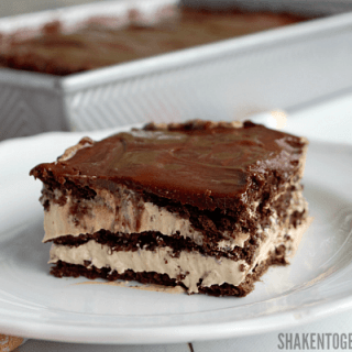Fluffy iced mocha filling is layered with chocolate graham crackers and fudgy frosting in this easy, amazingly delicious Iced Mocha Eclair Cake!