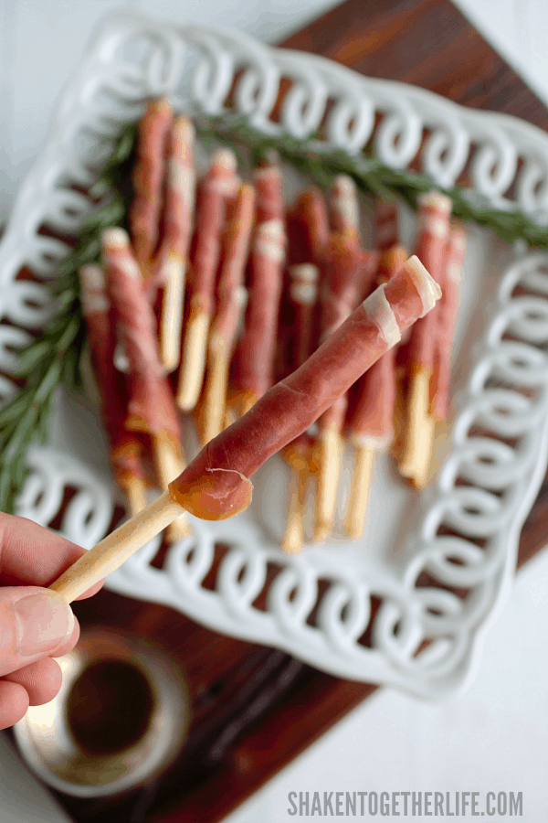 Prosciutto Wrapped Breadsticks - paper thin Italian ham wrapped around thin crispy breadsticks. These 2-ingredient appetizers are SO easy!