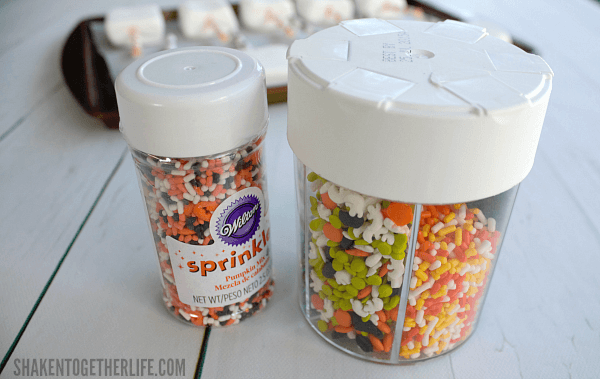 Quick and Easy Halloween Marshmallow Pops get festive with colorful sprinkles!