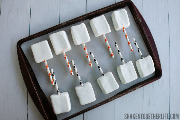 Quick and Easy Halloween Marshmallow Pops - these guys are ready to get dipped in chocolate and sprinkled!