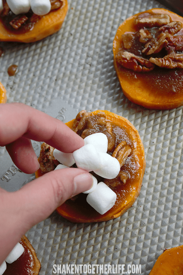 adding marshmallows to Sweet Potato Casserole Bites