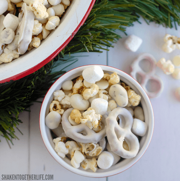 Winter Wonderland Snack Mix is the perfect sweet and salty mix of white fudge pretzels, mini marshmallows, yogurt covered cranberries, kettle corn and white chocolate chips!