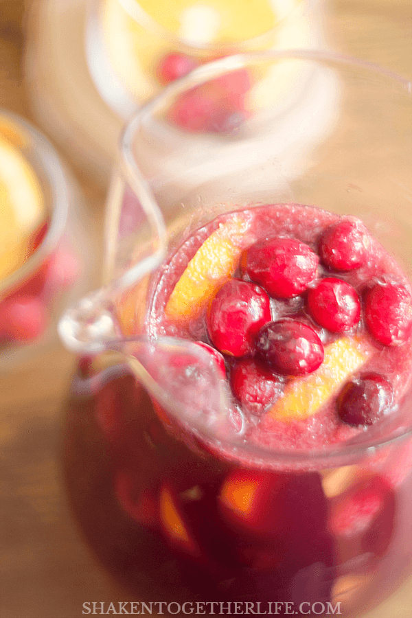 This Sparkling Sangria Punch is perfect for holiday parties - it isn't too sweet or boozy, so it will quickly become your entertaining go to!