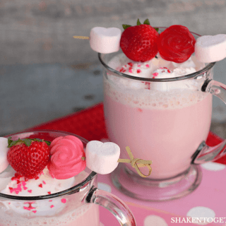 Cupid Cocoa - this is SO cute! Strawberry cocoa topped with whipped cream, sprinkles and a yummy kabob loaded with marshmallows, berries and gummy roses!