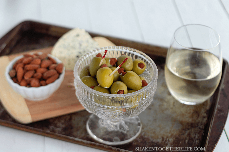 Almond & blue cheese stuffed olives are totally addictive and impossibly easy to make! A great addition to a cheese board or your game day spread!