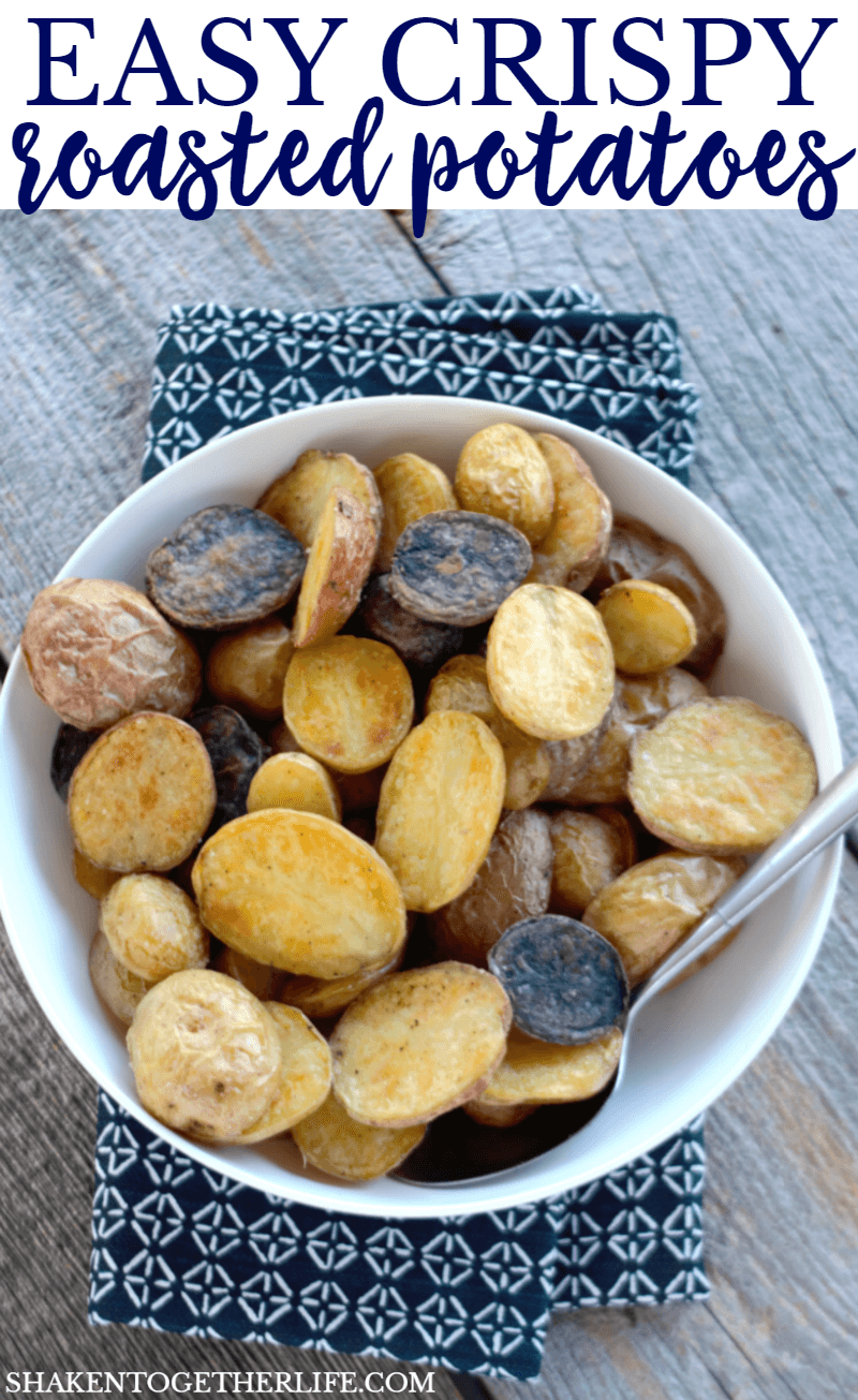 Crispy Roasted Gemstone Potatoes in a white bowl with a spoon