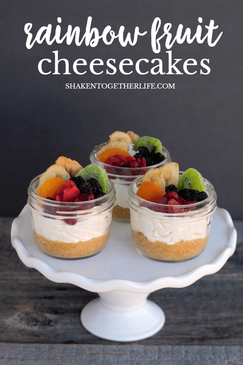 Rainbow Fruit Cheesecakes in a Jar with homemade graham cracker crust and rainbow fruit topping!