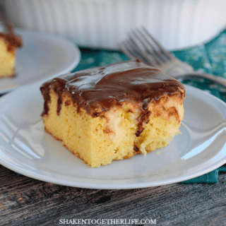 Boston Cream Pie Poke Cake - a tender yellow cake with pockets of vanilla pudding and a smooth chocolate frosting!