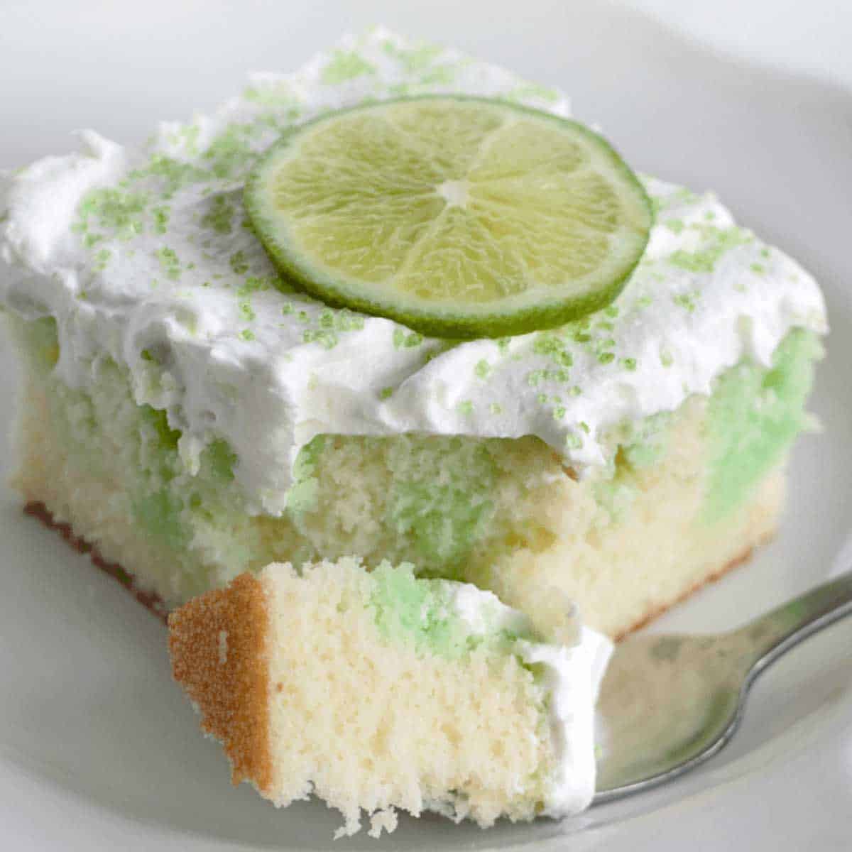 lime poke cake with bite taken out
