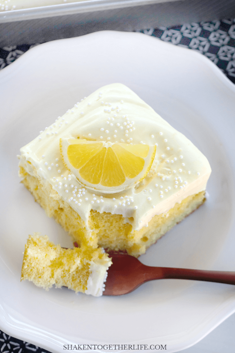 slice of triple lemon poke cake