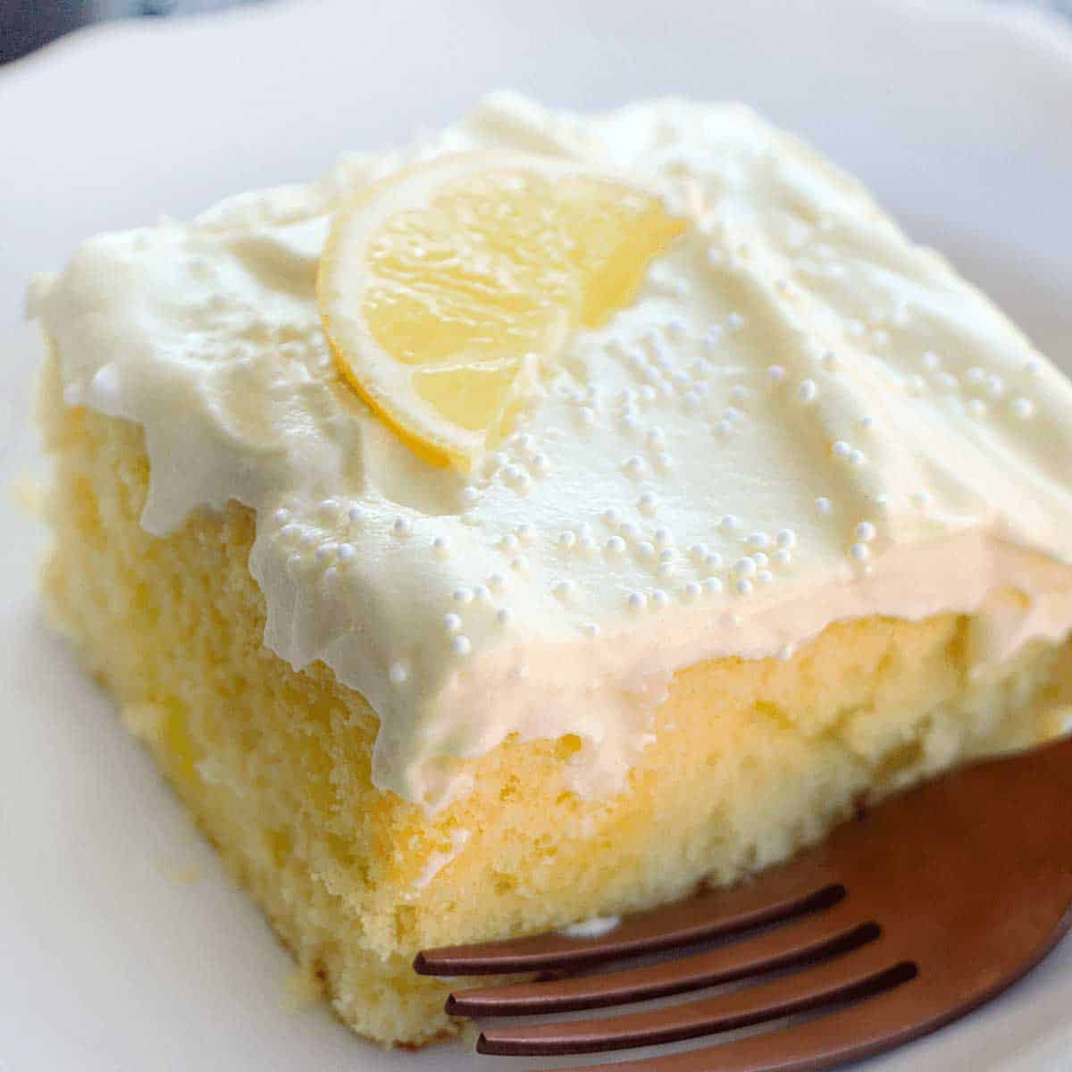 slice of lemon poke cake