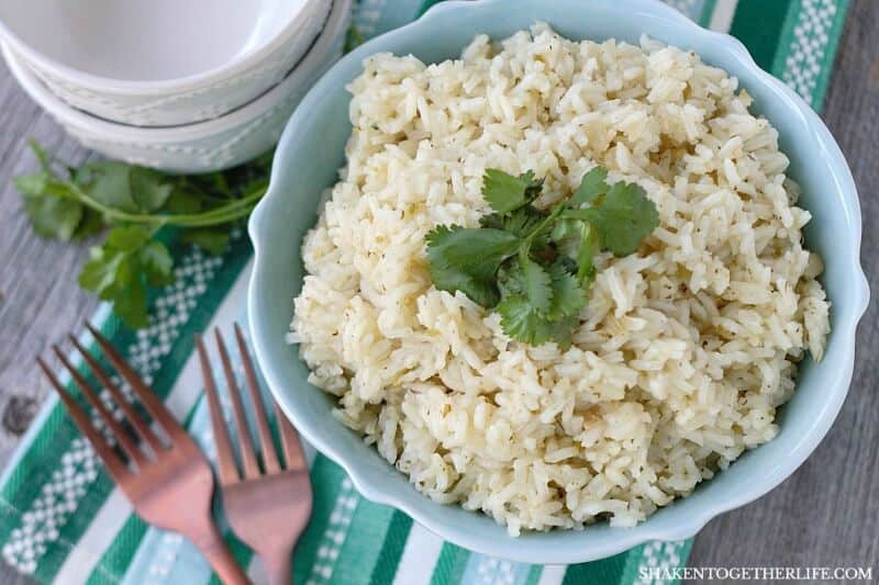 Simple Butter Cilantro Rice in w light blue bowl with two forks