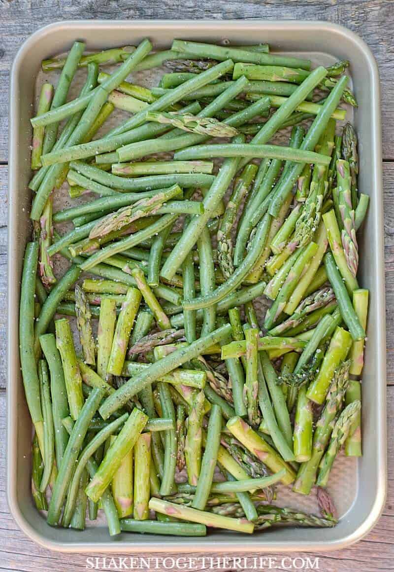 green beans and asparagus on baking sheet