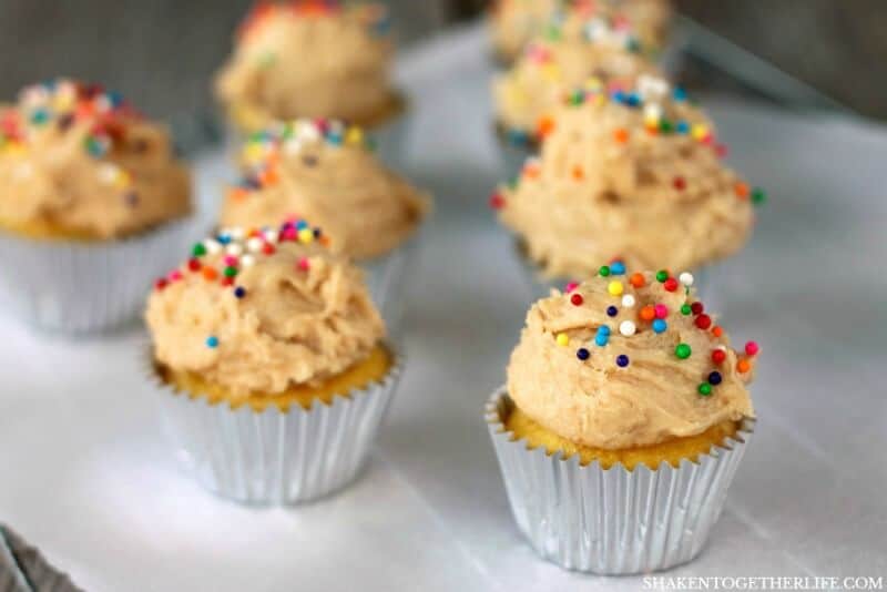 Mini Sugar Cookie Dough Frosted Cupcakes are the best of both worlds! Topped with an eggless sugar cookie dough, these cupcakes are trouble with a capital T!