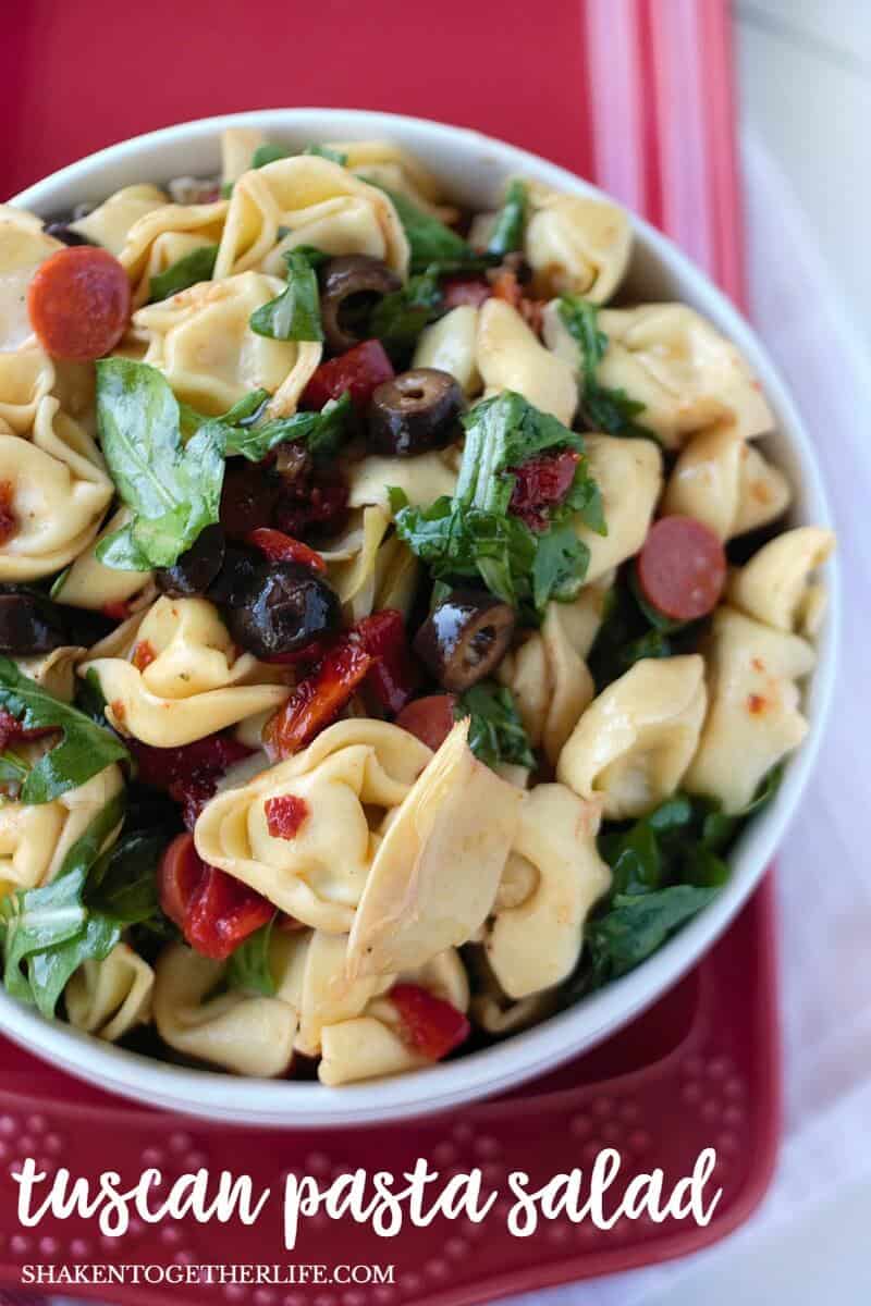 Tuscan Pasta Salad is packed full of hearty cheese tortellini, Italian vegetables, olives and pepperoni and drizzled with an easy essential oil vinaigrette! This Summer side dish is a hit for picnic and potluck season!