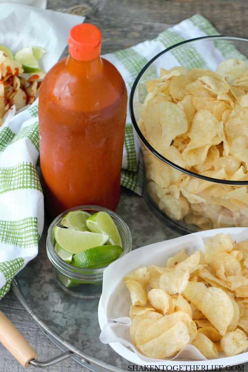 Kettle Chips in bowl with Hot Sauce & Lime wedges