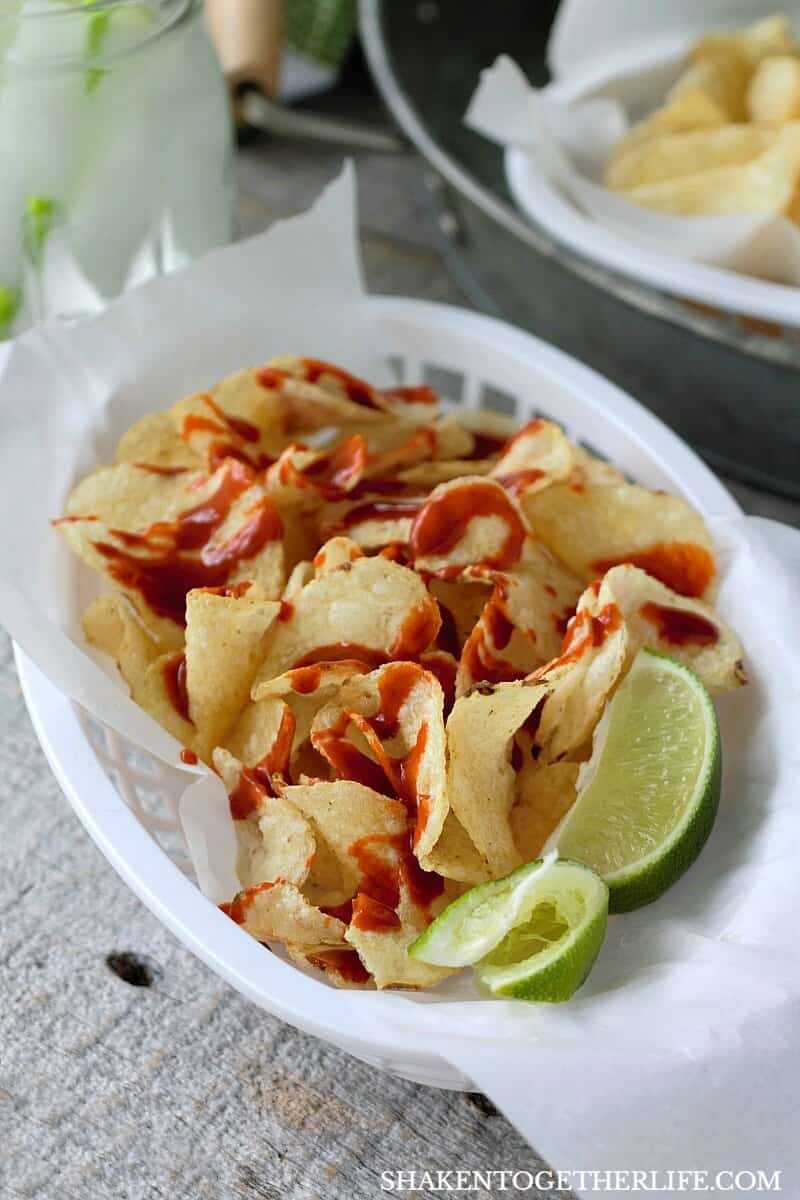 Mexican Street Chips with Hot Sauce & Lime in white plastic basket