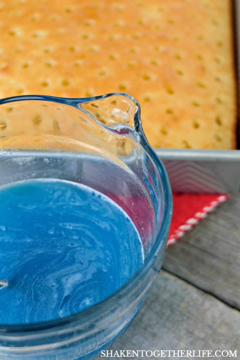 Blue Jell-o gives our Red, White & Blue Poke Cake one of its vibrant patriotic colors!