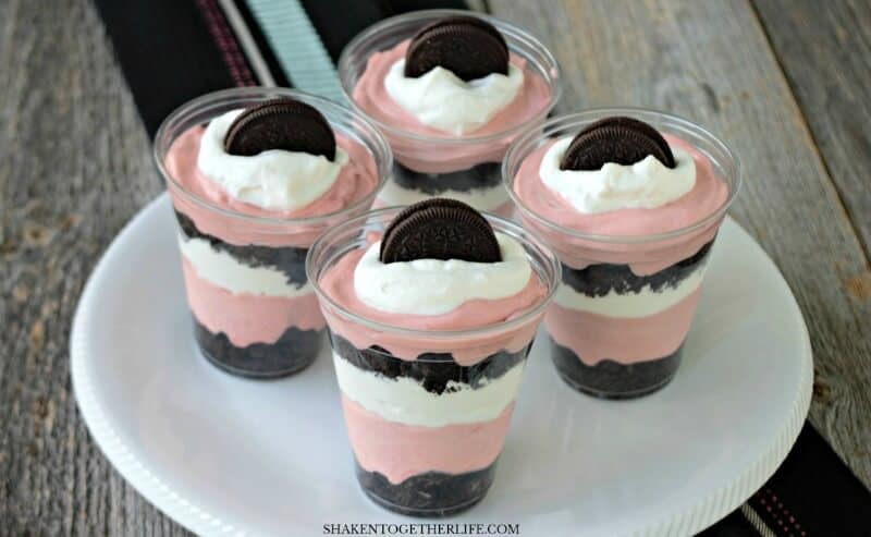 Fluffy red velvet pudding mousse is layered with crushed Oreos and whipped cream in these super easy no bake Oreo Red Velvet Pudding Cups!