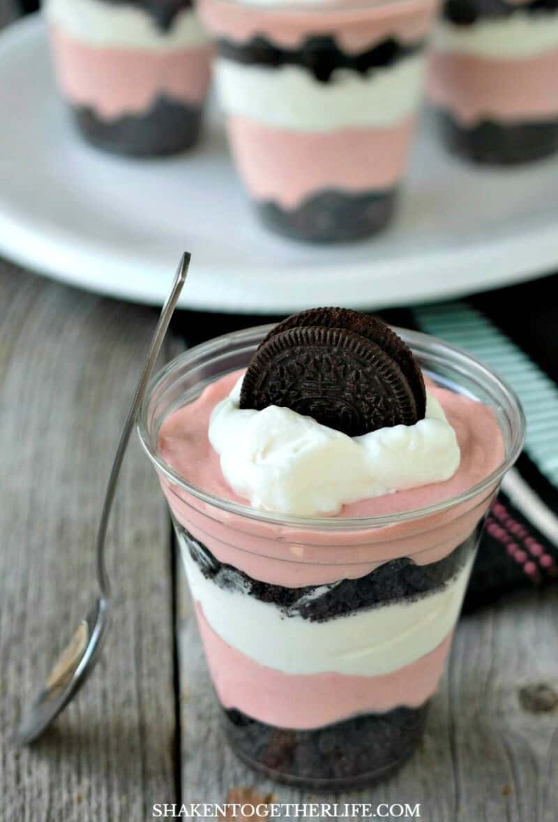 Fluffy red velvet pudding mousse is layered with crushed Oreos and whipped cream in these super easy no bake Oreo Red Velvet Pudding Cups!