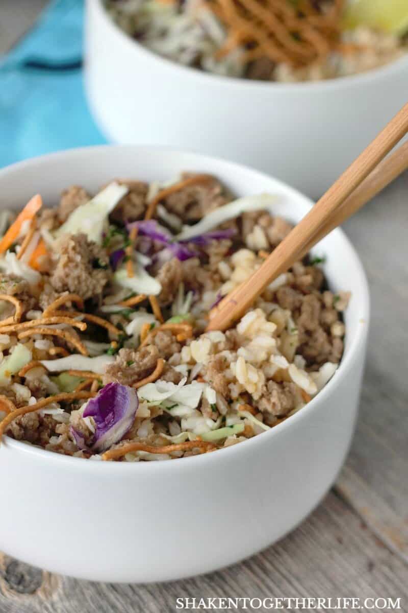 Korean Turkey Rice Bowls are filled with flavorful seasoned ground turkey, nutty brown rice, shredded cabbage and topped with crispy noodles for a quick and tasty weeknight meal!