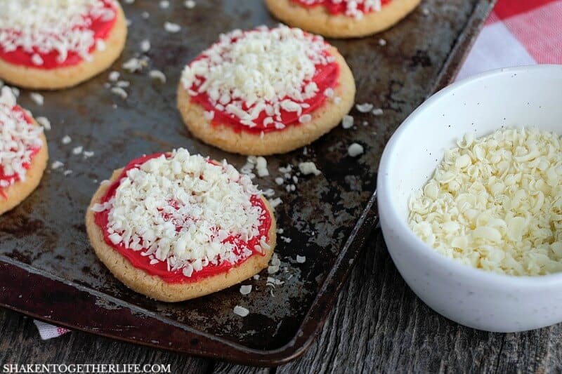 Grate a white chocolate bar for the cheese on these super cute Sugar Cookie Pizza Cookies!