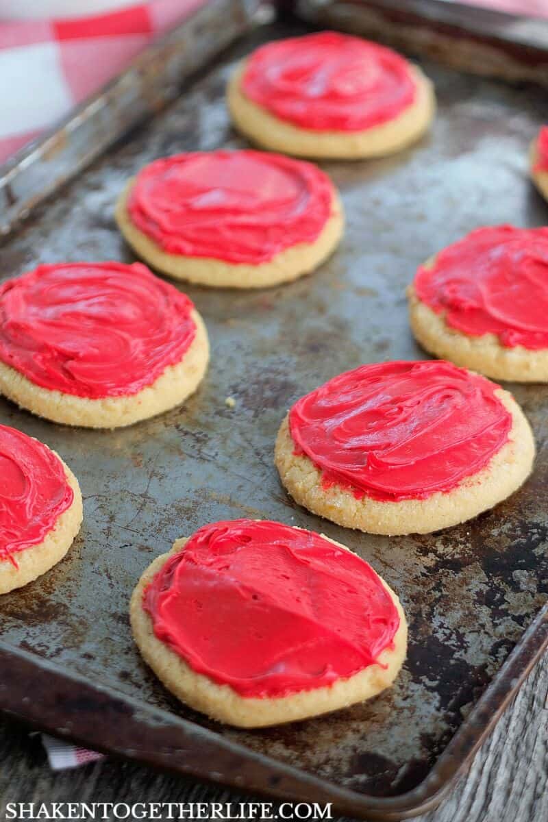 Red frosting is the 'sauce' on these super cute Sugar Cookie Pizza Cookies!