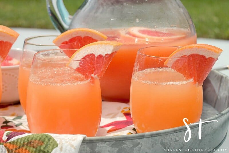 Bright and bubbly, these Ruby Red Grapefruit Mimosas will be the life of the party! This easy 2 ingredient cocktail recipe is perfect for pool parties, a day with the girls and brunch!