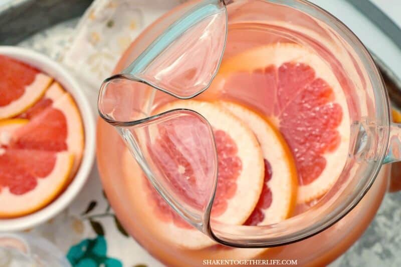 Ruby Red Grapefruit Mimosas in glass and pitcher