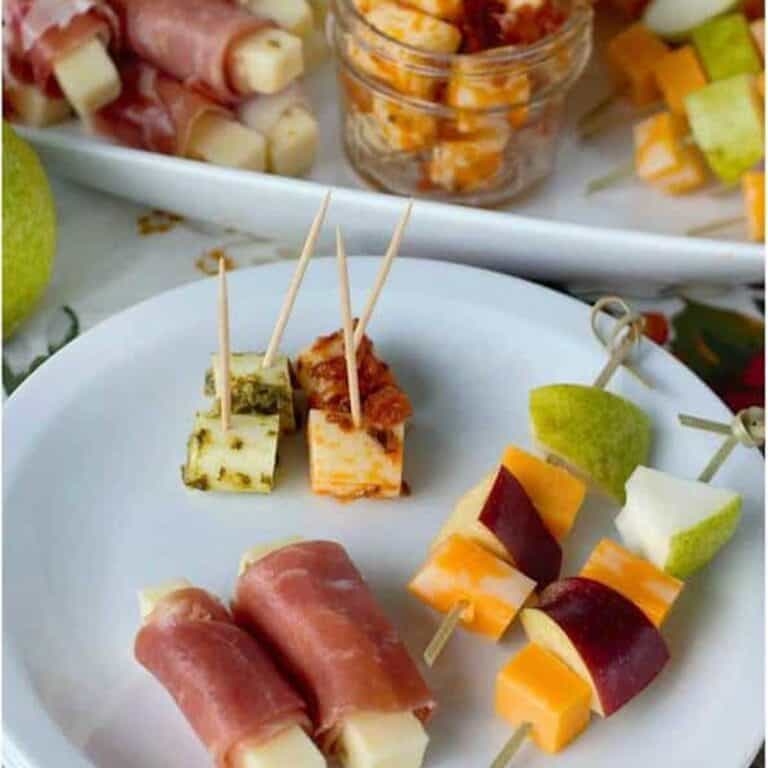 cheese stick appetizers on white plate