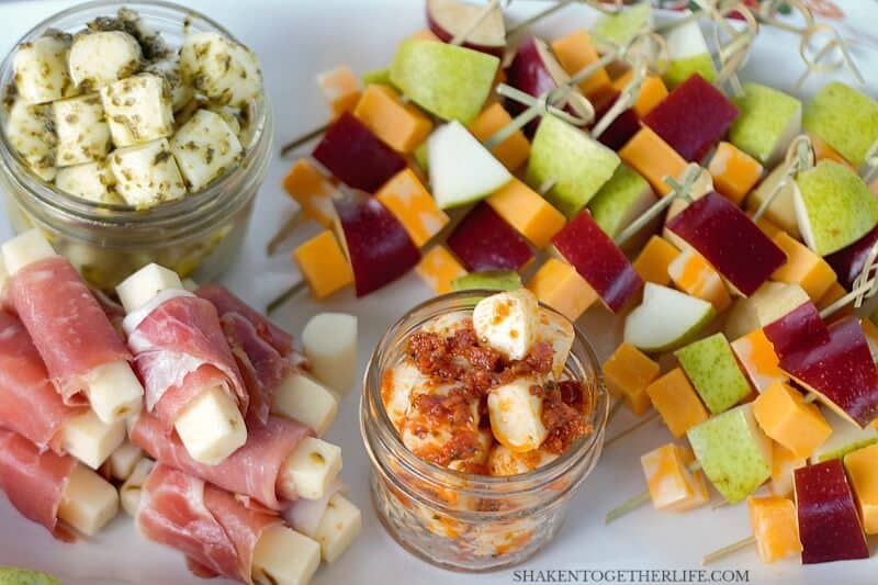 3 EASY Cheesy Appetizers - these simple cheese appetizers start with cheese sticks! Pesto mozzarella bites, prosciutto wrapped pepper jack and fruit & cheese skewers are simple, delicious and perfect for entertaining!