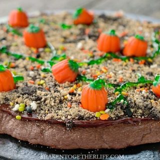 Need an easy Fall or Halloween dessert? This Pumpkin Patch Dessert Pizza is a chocolate-y field of delicious candy pumpkins!