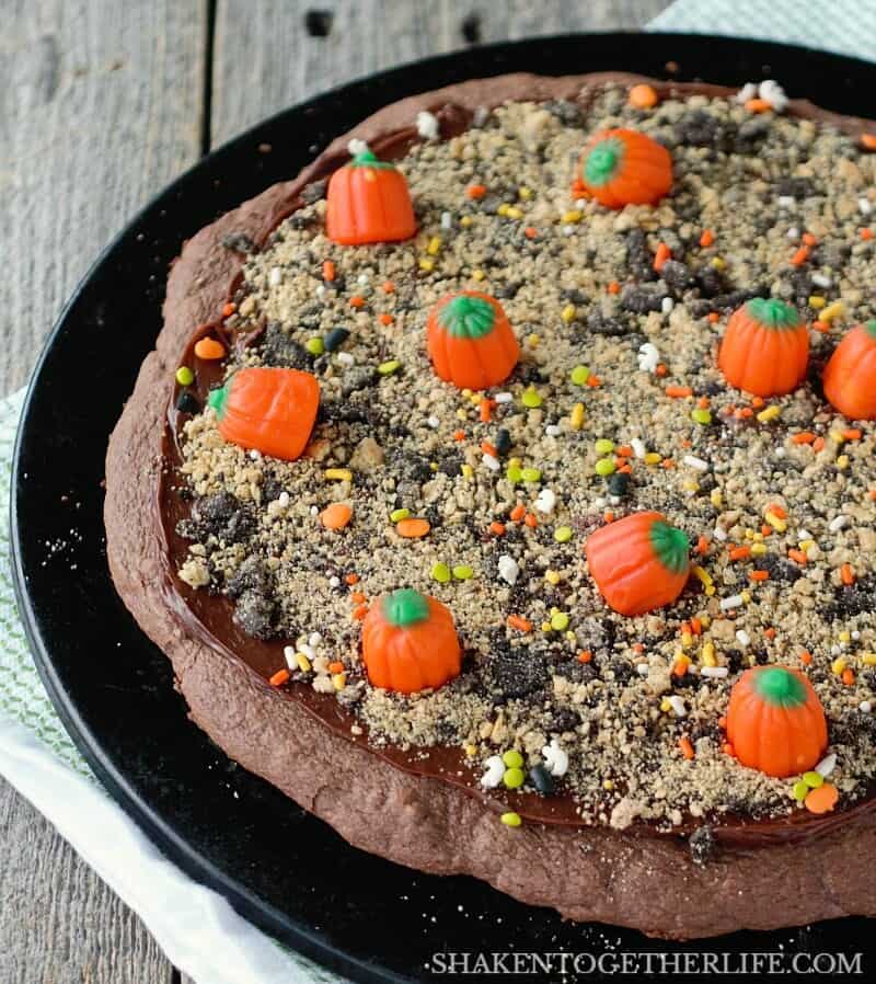 Mellowcreme candy pumpkins fill the field of our Pumpkin Patch Dessert Pizza! What an adorable Halloween or Fall dessert idea!