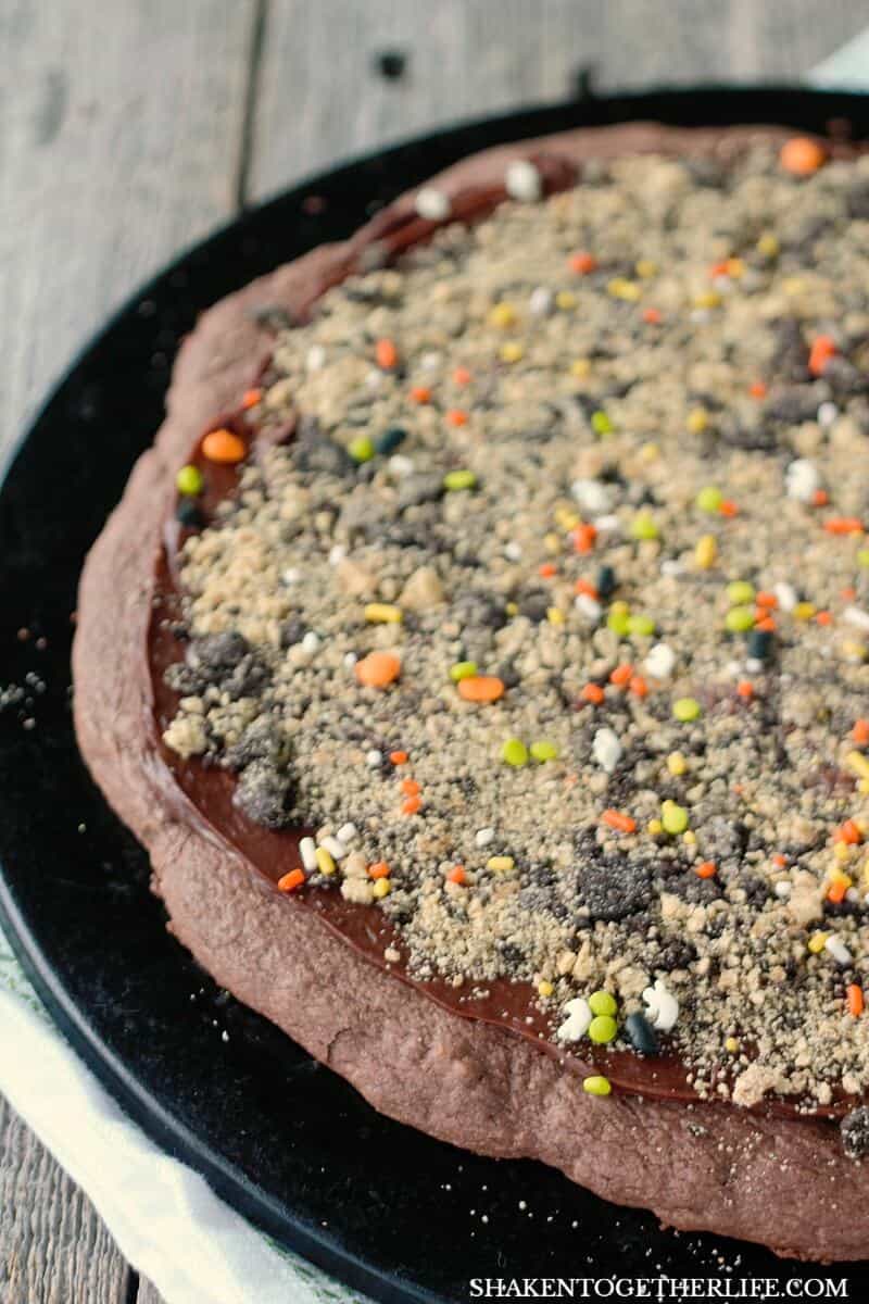 Up next on this chocolate lovers Pumpkin Patch Dessert Pizza is a dusting of Halloween sprinkles!