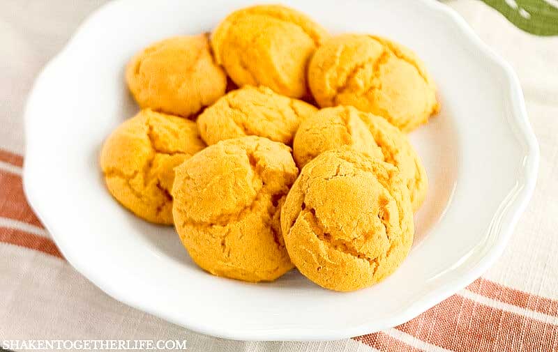 white plate with pumpkin cookies