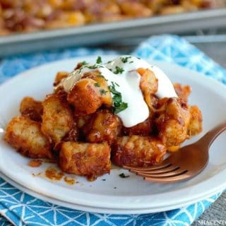 Ooey gooey cheesy Sheet Pan Chili Cheese Tater Tots are the perfect game day comfort food! Load them up with sour cream and chives, crumbled bacon or even drizzle them with your favorite BBQ sauce!