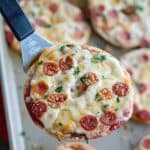 Thin Crust Bagel Pizzas are an easy weeknight dinner or addition to your game day spread! Load bagel thins with your favorite pizza toppings, bake until melty and dig in!