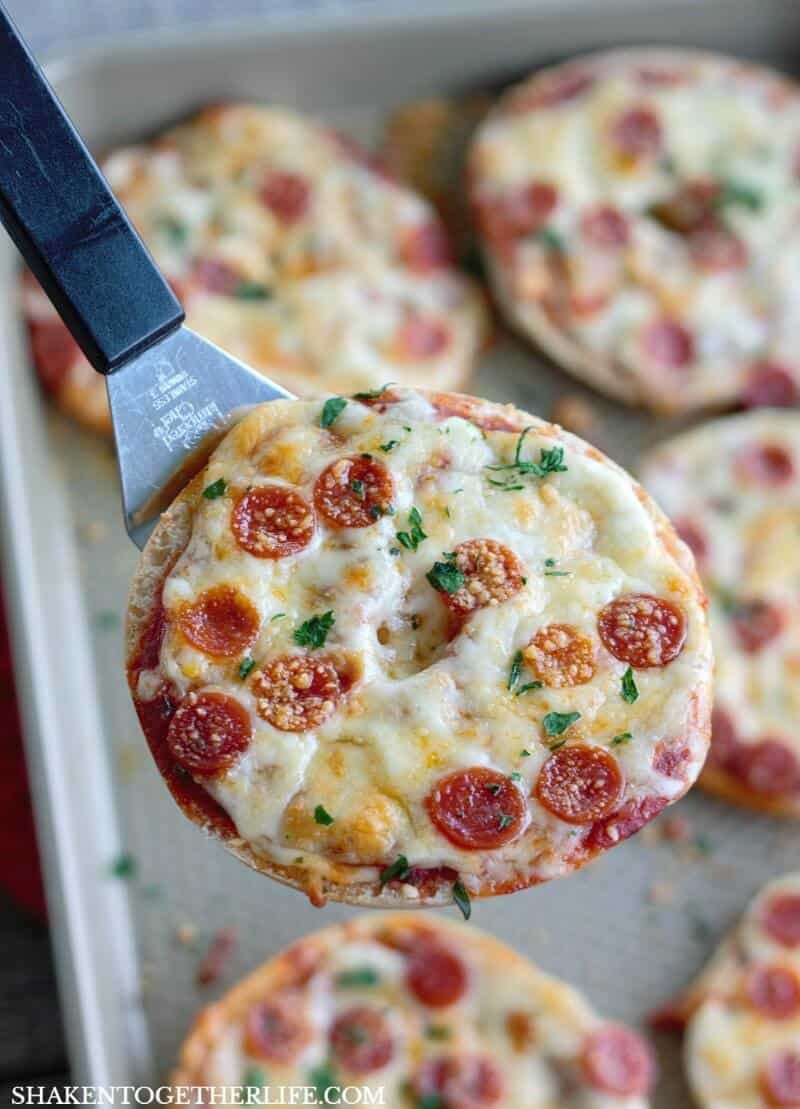 Thin Crust Bagel Pizzas are an easy weeknight dinner or addition to your game day spread! Load bagel thins with your favorite pizza toppings, bake until melty and dig in!