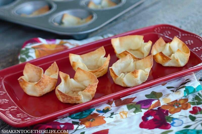wonton cups on red plate with floral napkin