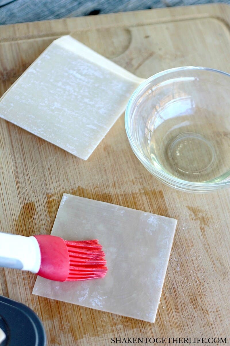 How to make wonton cups: step 1, brush or mist both sides of the wonton wrappers with vegetable or light olive oil.