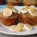 These Banana Bread Baked Oatmeal Cups are hearty, healthy and freezer friendly! Top with bananas, walnuts and a drizzle of syrup for a healthy breakfast!