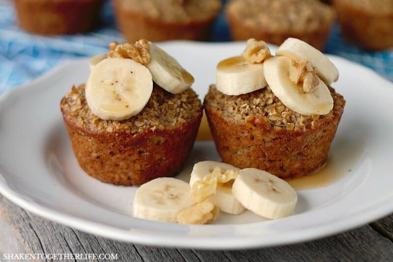 These Banana Bread Baked Oatmeal Cups are hearty, healthy and freezer friendly! Top with bananas, walnuts and a drizzle of syrup for a healthy breakfast!