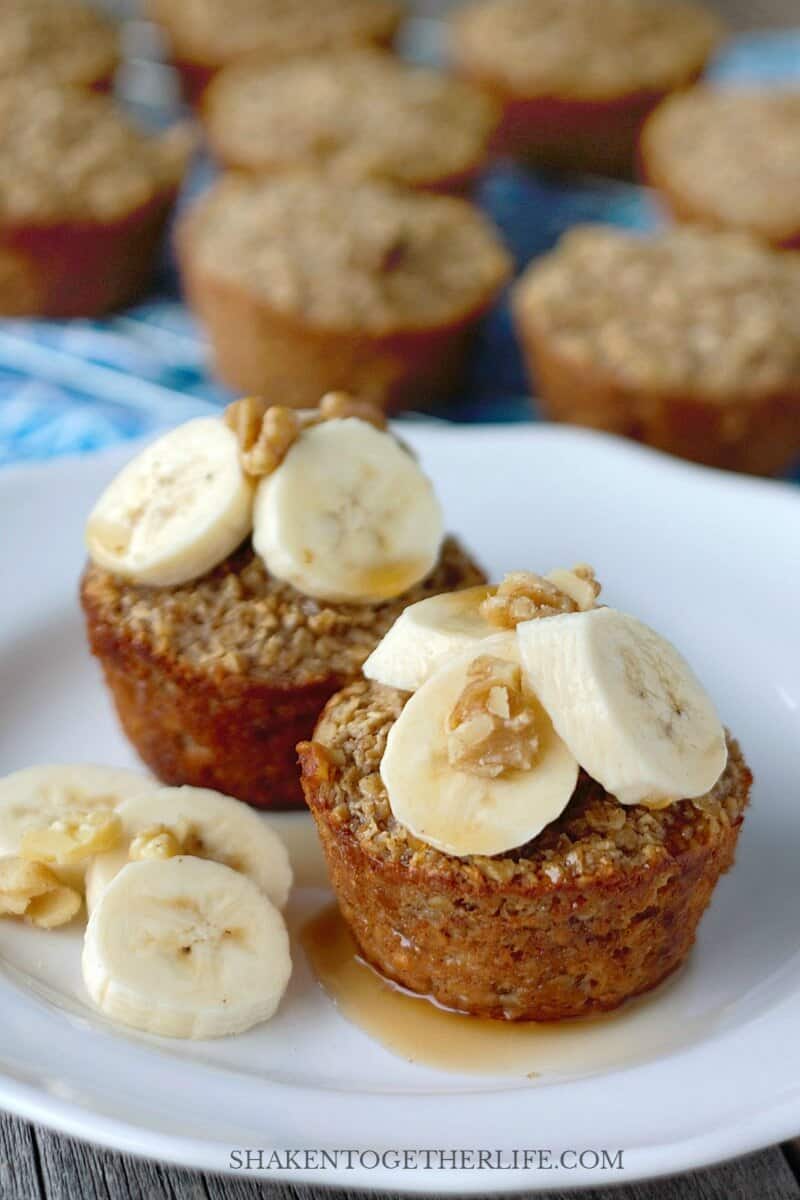 These Banana Bread Baked Oatmeal Cups are hearty, healthy and freezer friendly! Top with bananas, walnuts and a drizzle of syrup for a healthy breakfast!