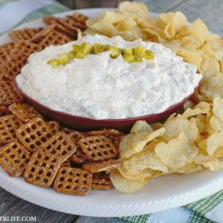 Creamy Cheesy Dill Pickle Dip is packed with tangy dill pickles, dill, garlic and sharp cheddar cheese. This game day appetizer dip is a touch down for sure!