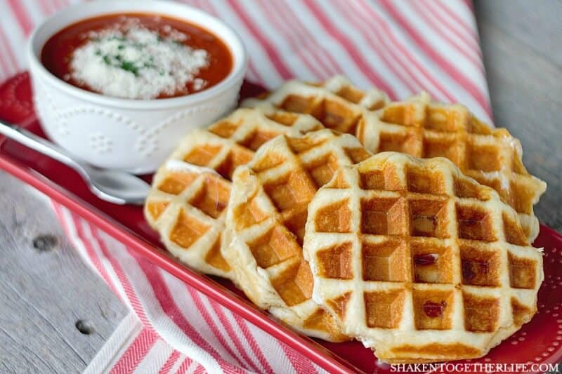 Pizza Stuffed Waffles start with refrigerated biscuits then stuffed with creamy mozzarella, mini pepperoni and are waffled to perfection in about 5 minutes flat! What an easy dinner idea!