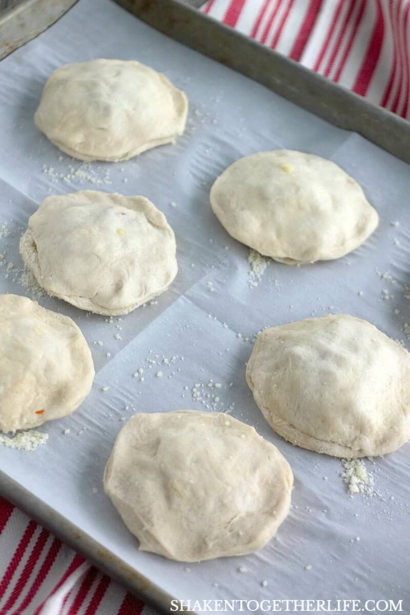 Pizza Stuffed Waffles! Once the biscuits are stuffed, seal the edges and pop them in a waffle maker!