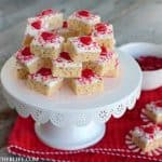 Valentine's Day Krispie Bities! Chocolate dipped krispie bites are topped with a chewy cinnamon heart and festive sprinkles for an easy no bake Valentine's Day treat!