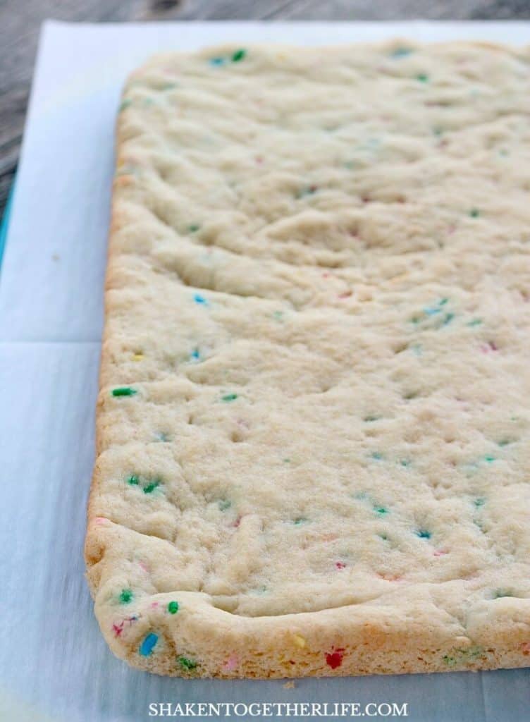 Funfetti Cookie Bars from a cake mix bake up tender, studded with colorful sprinkles.