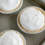 mini cheesecakes on baking sheet