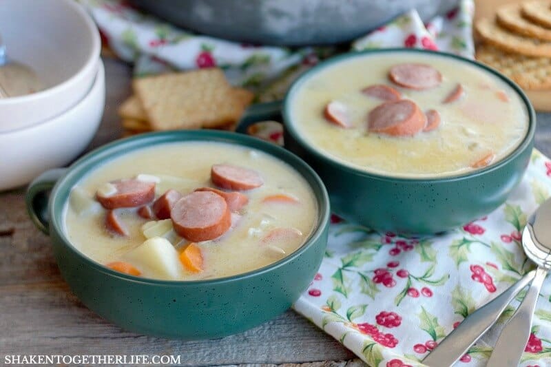 Grandma's Creamy Sausage & Potato Soup in two green bowls